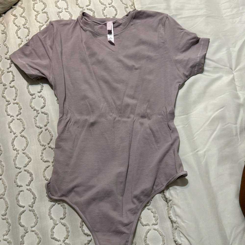 Skims body suit , lavender with cap sleeve